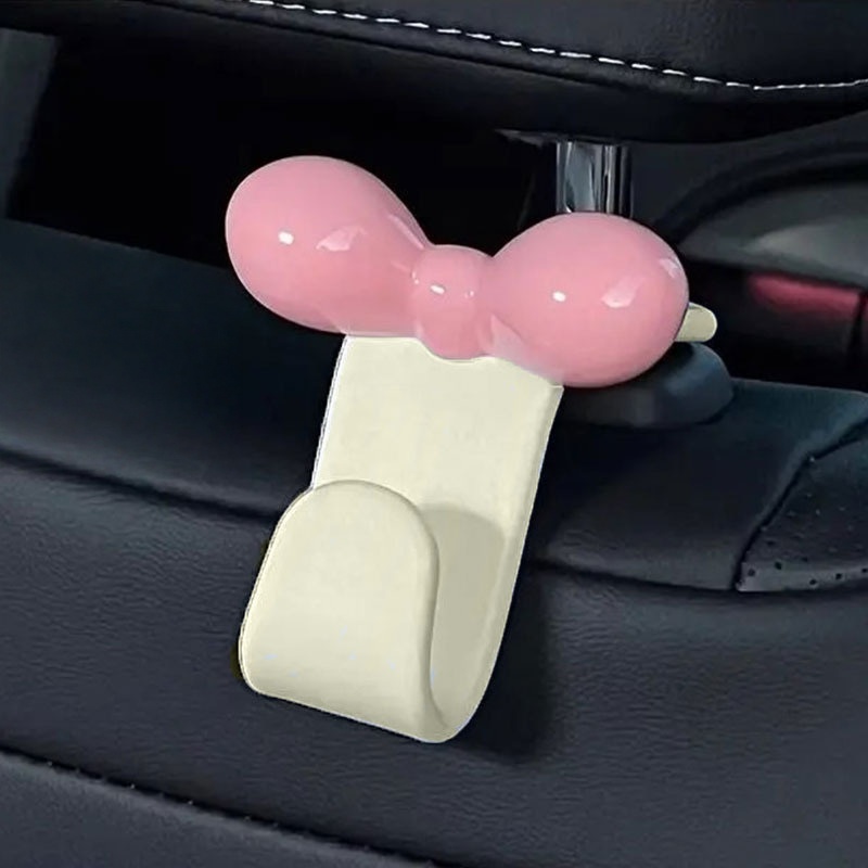 Travel Accessories Gadget - ミニマリストなボウ型車用後部座席吊り下げフック、実用的な収納アクセサリー、ハンドバッグ、軽食、車内旅行用品用